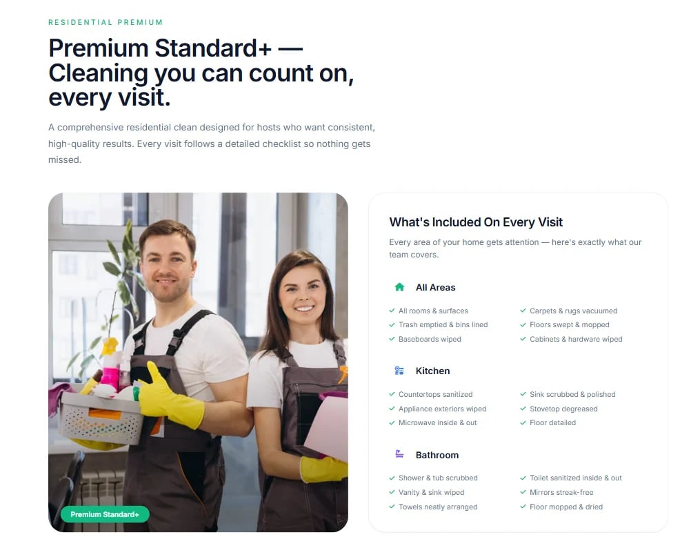 Two professional cleaners in aprons and gloves holding cleaning supplies and smiling at camera in a bright home interior